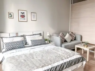 Cozy bedroom with stylish decor and comfortable seating area