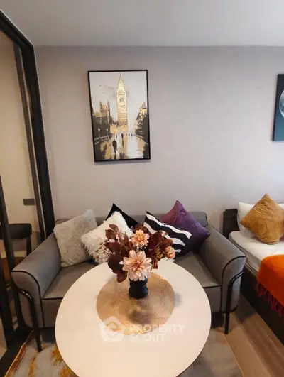 Stylish living room with modern decor and cozy seating area, perfect for relaxation.