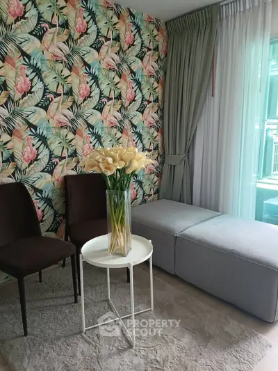 Stylish living room with floral wallpaper and elegant furniture
