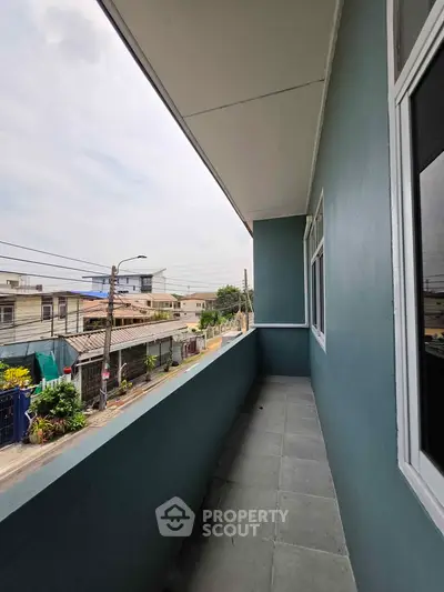 Spacious balcony with urban view in modern residential building