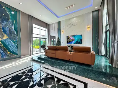 Luxurious modern living room with high ceilings, elegant decor, and large windows offering natural light.