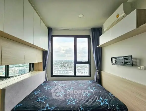 Modern bedroom with city view, featuring built-in storage and air conditioning.