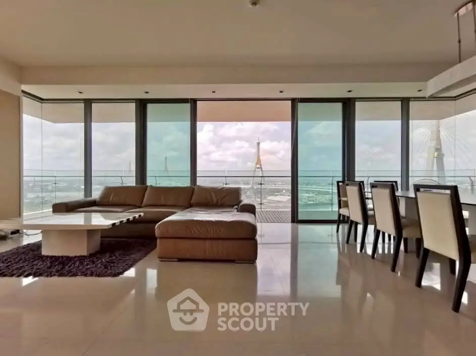 Luxurious living room with stunning panoramic view and elegant furnishings.