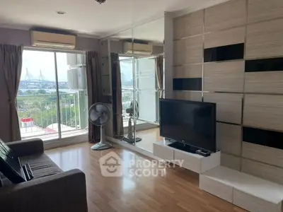 Modern living room with balcony and city view, featuring sleek decor and natural light.