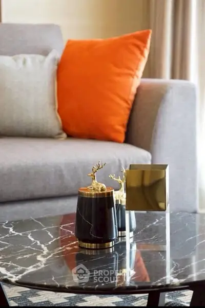 Stylish living room with modern decor and elegant marble coffee table.