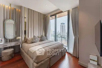 Elegant bedroom with plush bedding, floor-to-ceiling windows offering a cityscape view, and modern furnishings for a luxurious living experience.