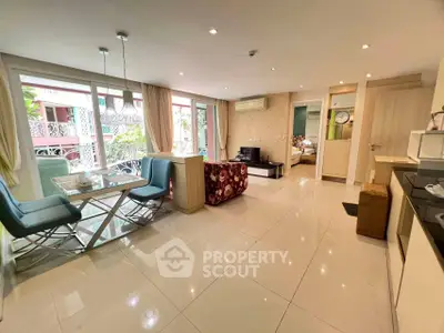 Spacious open-plan living room with modern kitchen and dining area