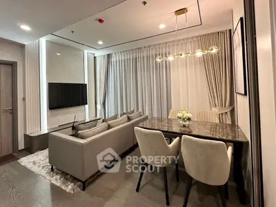 Elegant modern living room with stylish dining area and cozy seating