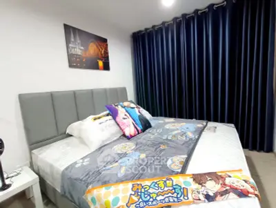 Cozy bedroom with modern decor and plush bedding in a stylish apartment.