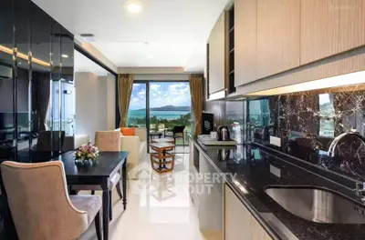 Luxurious open-layout kitchen and living room with stunning ocean view