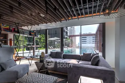 Luxurious modern living room with pool view and stylish decor