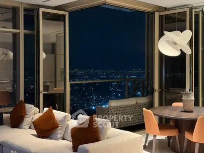 Luxurious living room with stunning night city view, modern decor, and elegant lighting.
