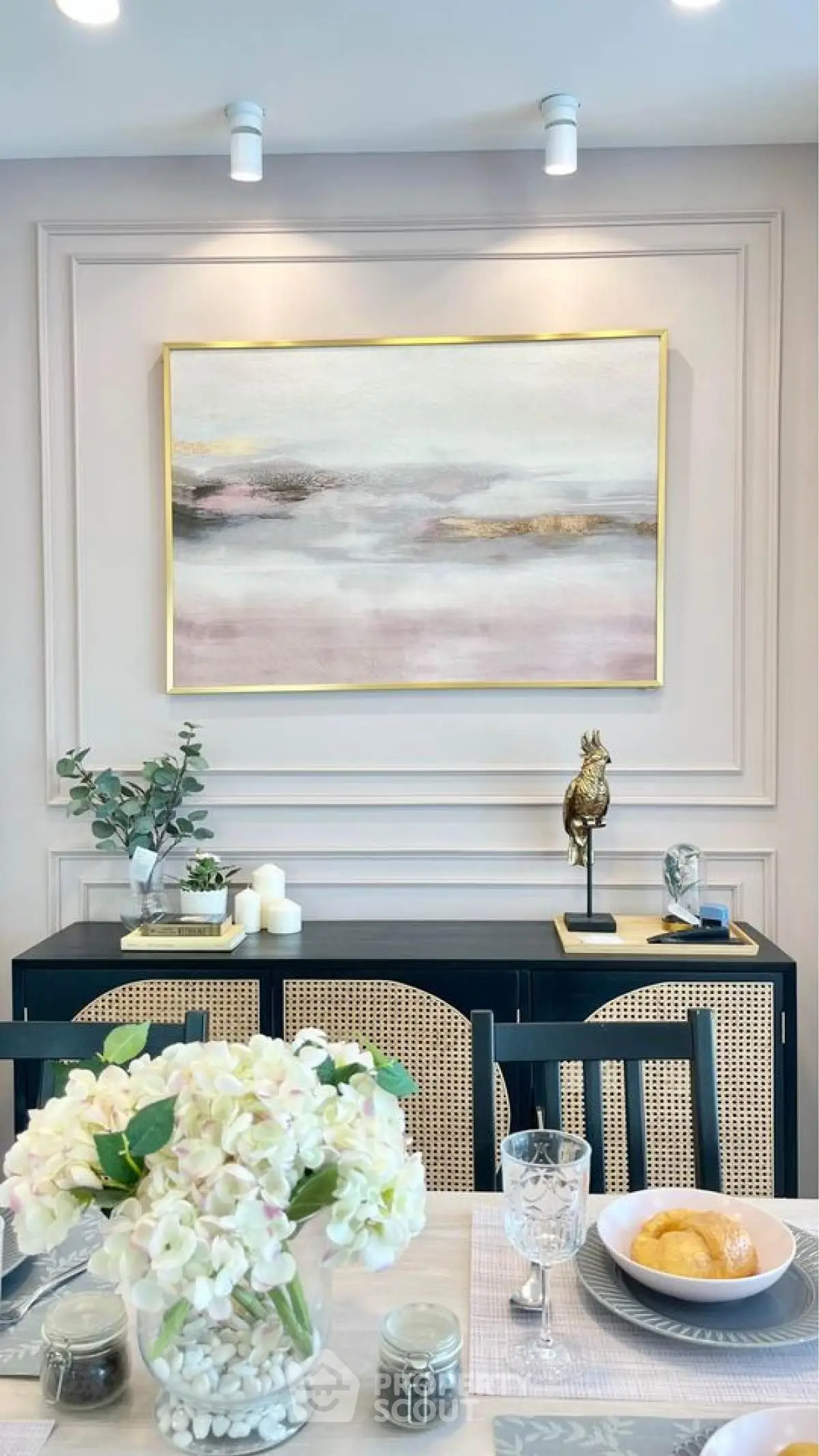 Elegant dining room with modern art and stylish decor