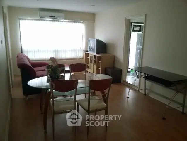 Spacious living room with modern furniture and natural light