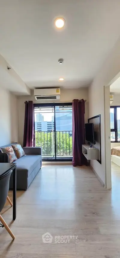 Modern living room with balcony view and sleek interior design