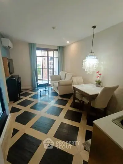 Chic living room with modern decor and large windows in a stylish apartment.