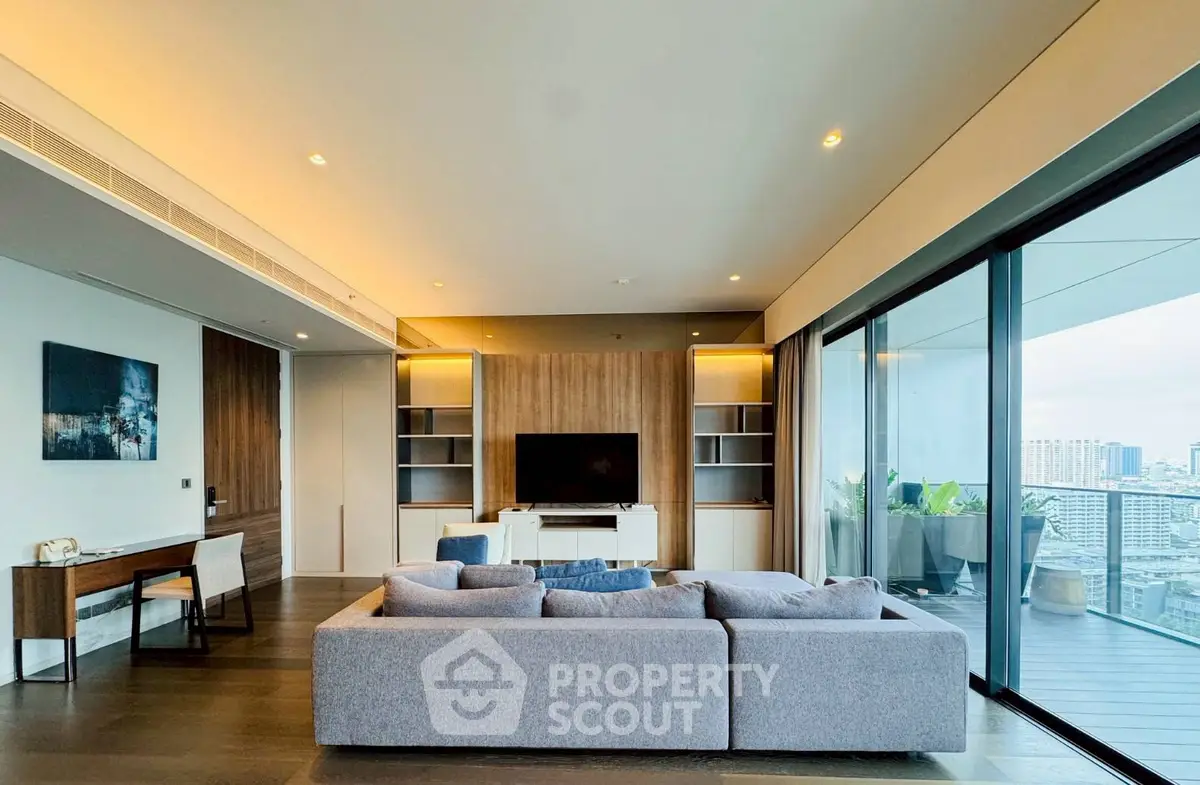 Luxurious modern living room with panoramic city view and spacious balcony.