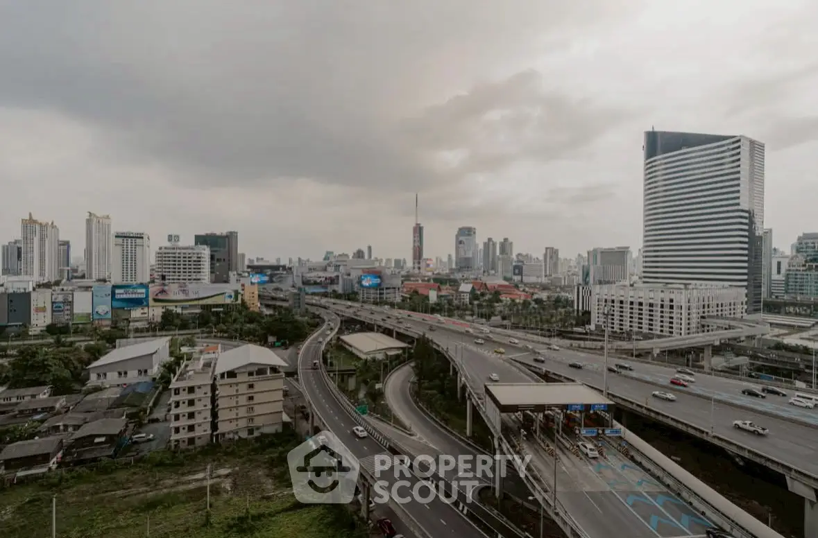 Stunning cityscape view with modern skyscrapers and highway, perfect for urban living enthusiasts.