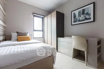 Modern bedroom with stylish decor and ample natural light