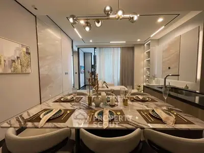 Luxurious modern dining room with elegant table setting and stylish lighting in a contemporary apartment.