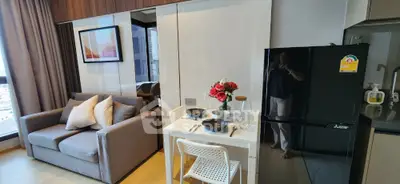 Modern living room with cozy sofa and dining area in stylish apartment