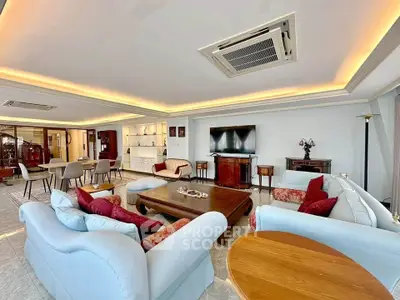 Spacious and elegant living room with modern furniture and ambient lighting