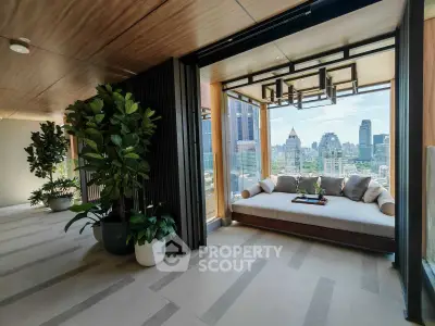 Luxurious balcony with stunning city view and cozy seating area