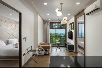 Modern living room with balcony and scenic view, featuring elegant decor and natural light.