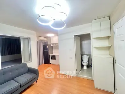 Modern apartment interior with cozy living room and compact kitchen