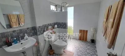 Spacious modern bathroom with elegant tile design and natural light