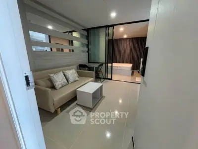 Modern open-layout living room with stylish decor and cozy ambiance