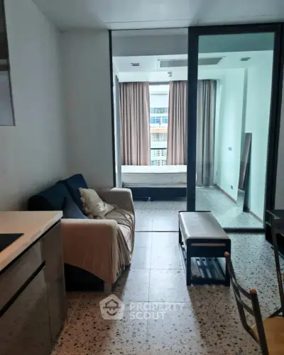 Modern studio apartment with open layout and large windows