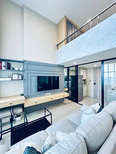 Modern living room with loft, sleek design, and stylish furniture in a contemporary apartment.