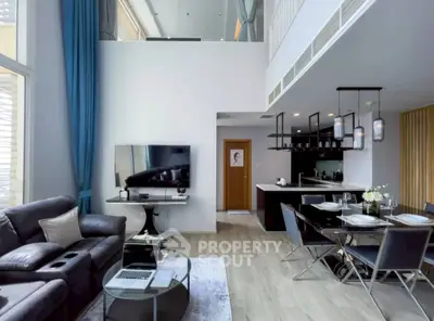 Luxurious modern living room with high ceilings and open kitchen layout