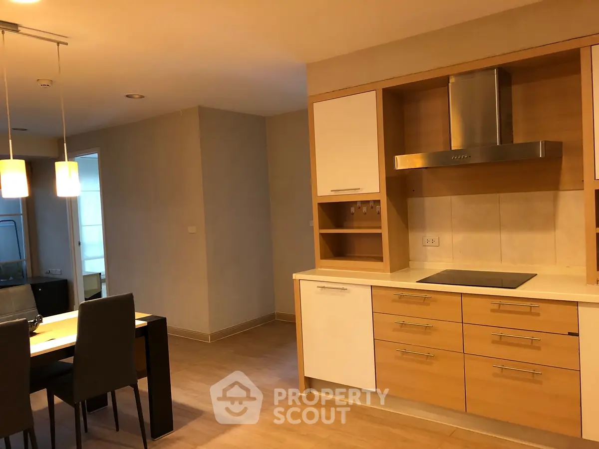 Modern kitchen with dining area and sleek cabinetry