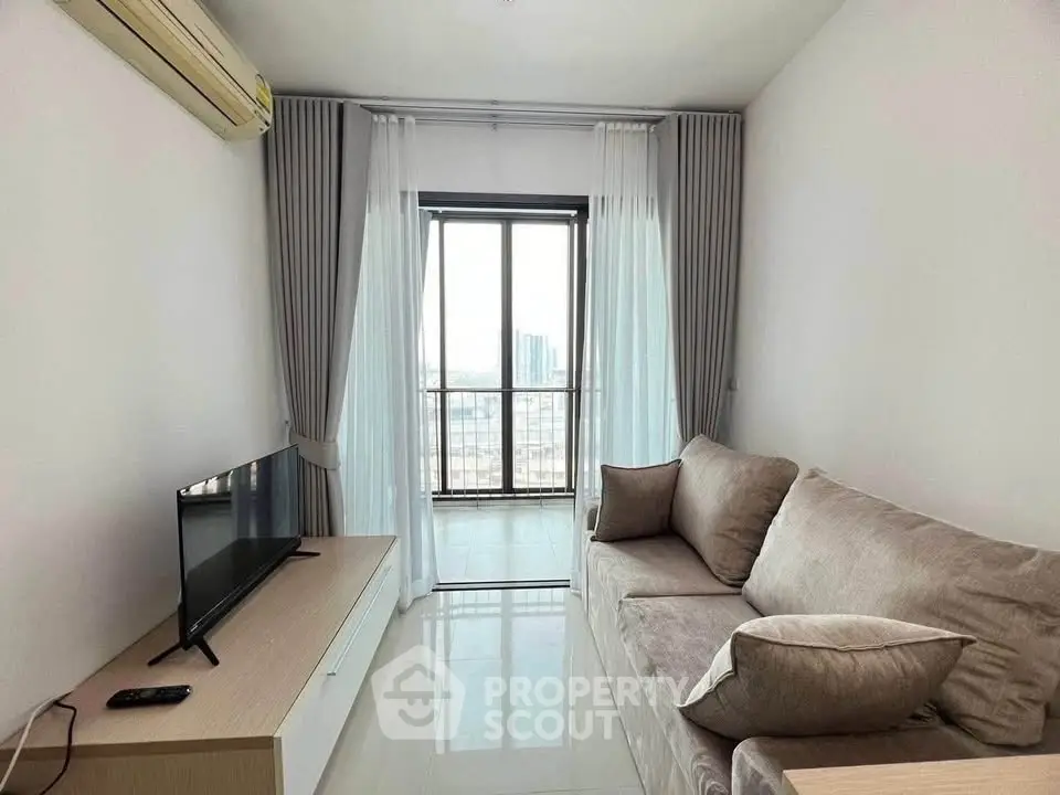 Modern living room with cozy sofa and large window offering city view