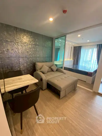 Modern living room with stylish decor and cozy seating in a contemporary apartment.