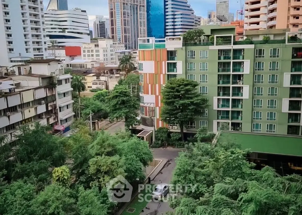 Stunning urban view of modern apartment buildings surrounded by lush greenery in a vibrant cityscape.