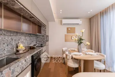 Modern kitchen and dining area with elegant decor and natural light