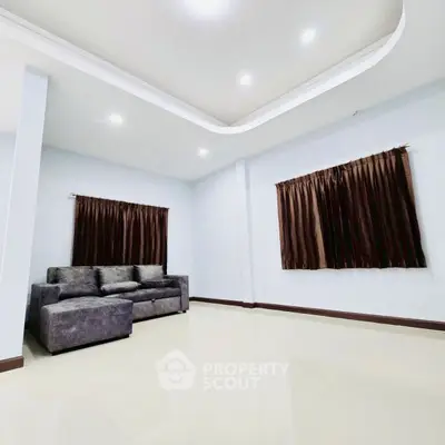 Spacious living room with modern sofa and elegant ceiling lights