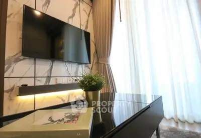 Modern living room with wall-mounted TV and elegant decor