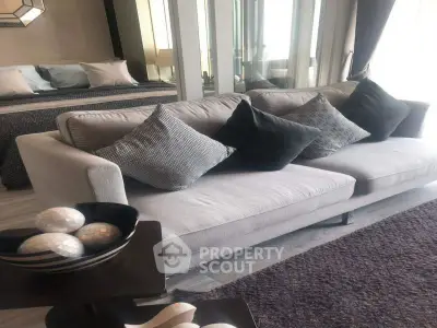 Stylish modern living room with cozy gray sofa and elegant decor