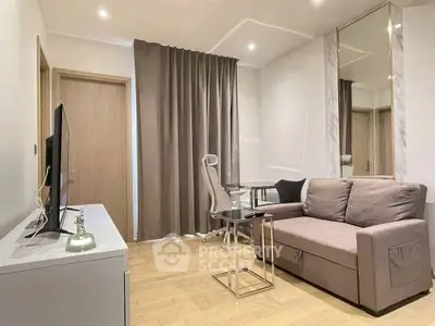 Modern living room with sleek furniture and natural light, perfect for urban living.