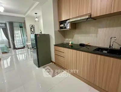 Modern kitchen with sleek wooden cabinets and open layout in stylish apartment