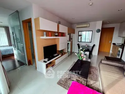 Modern open-plan living room with stylish decor and natural light