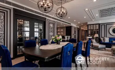 Luxurious dining room with elegant decor and plush blue chairs