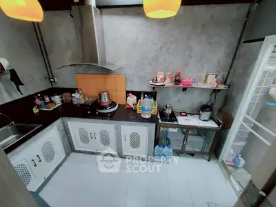 Charming kitchen with modern appliances and ample storage space, perfect for culinary enthusiasts.
