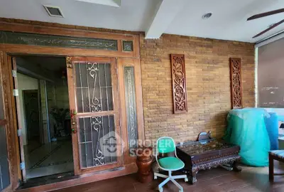 Charming interior with rustic brick wall and elegant wooden door
