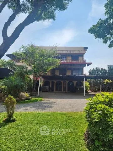 Charming multi-story home with lush garden and spacious driveway