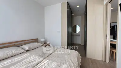 Modern bedroom with minimalist design and ample natural light